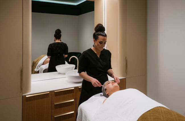 A woman receiving a facial.