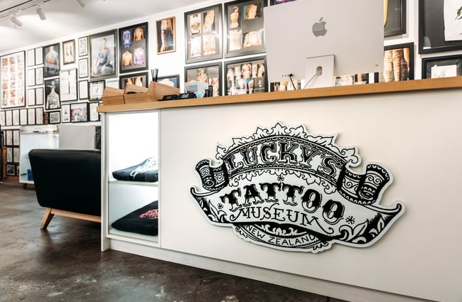 Lucky's Tattoo Museum signage on the front counter.