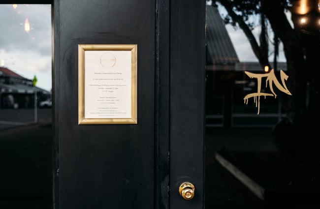 A menu is fixed to the exterior door of Lustre.