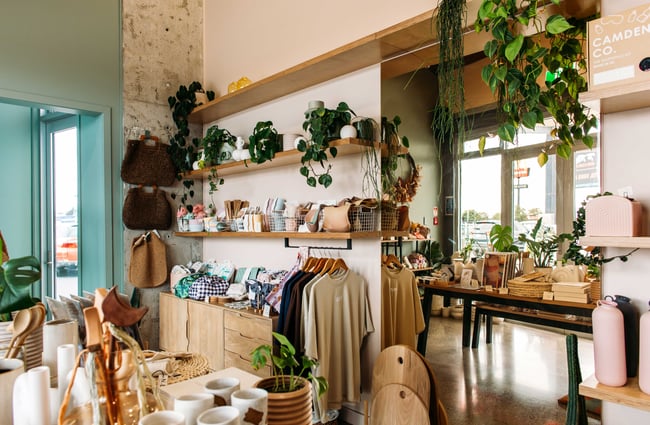 Homewares and clothes on display inside a brightly coloured Lykke.
