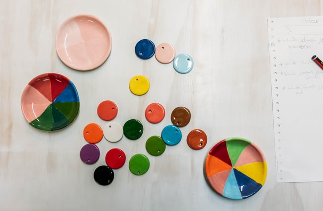 Flatlay of colourful ceramics in Mabel Vickers.