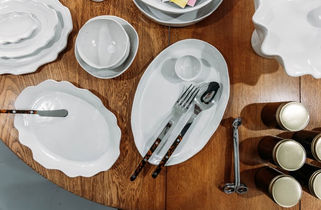 Flatlay of plates and cutlery on the table at Mabel Vickers.