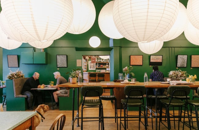Diners sitting at tables inside the cafe.