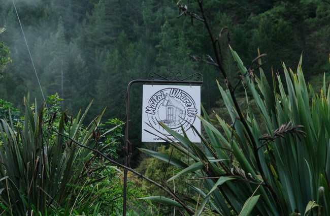 A black and white Maitai Whare Iti sign.