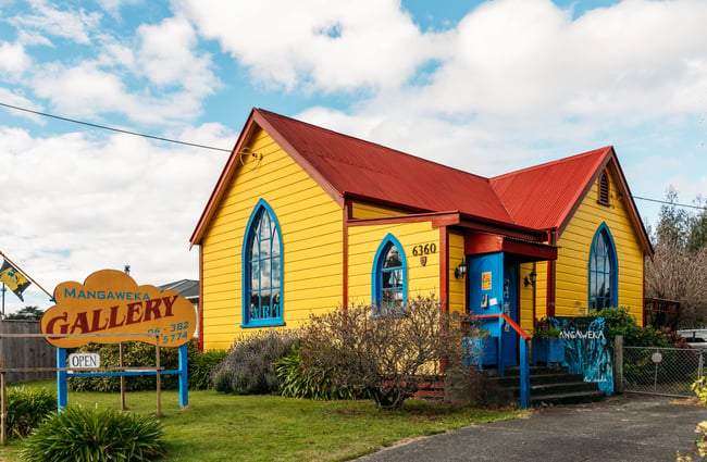 The yellow, red and white exterior of Mangaweka Gallery in Rangitikei.