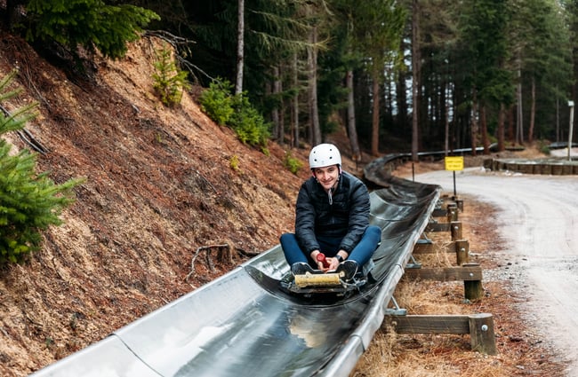 A man on a luge.