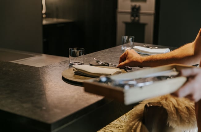 Cutlery being set by Giulio in his restaurant.