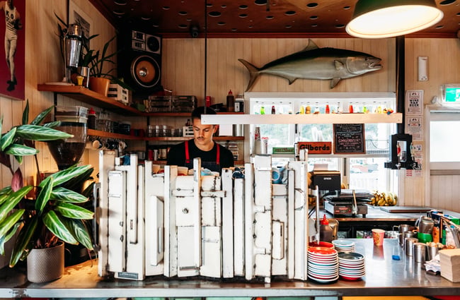 Barista making coffee at Maranui Cafe in Lyall Bay Wellington