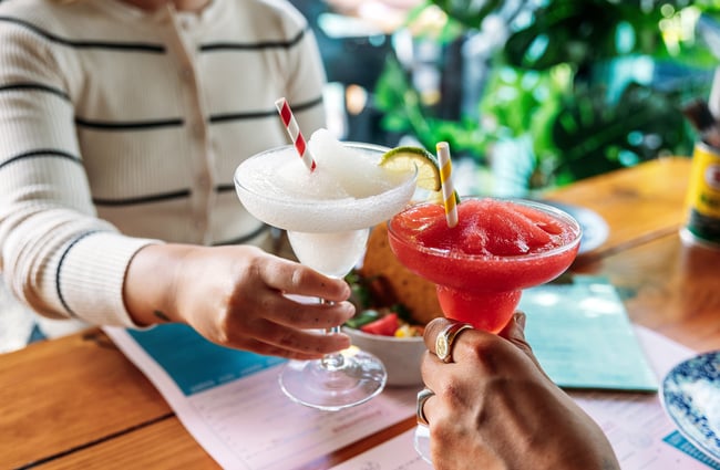 Two cocktails on a table.
