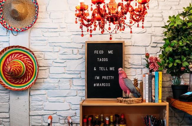 Decorative Mexican items on shelves.