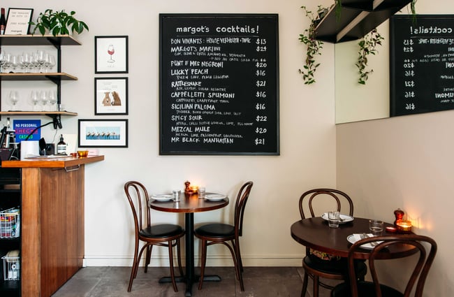 A cocktail blackboard on the wall at Margot Wellington.
