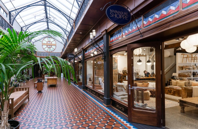 The entrance to a store from inside an old shopping centre.