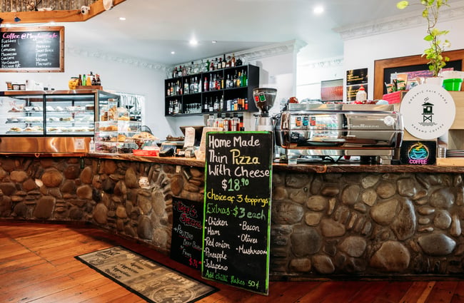 Menu and counter view at Mayfair Cafe.