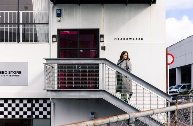 A woman walking into Meadowlark Jewellery.