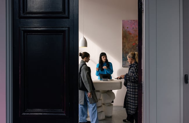 Three women chatting at Meadowlark Jewellery.