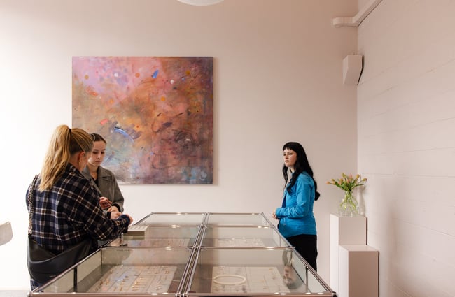 A staff member chatting to customers at Meadowlark.