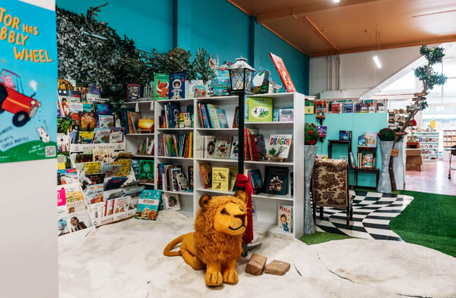 Children's area with a toy lion in Mewington's Book Shoppe.