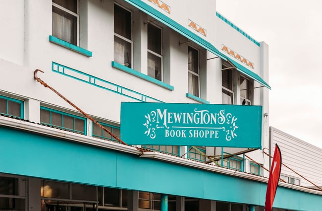 Teal coloured roof signage at Mewington's Book Shoppe.