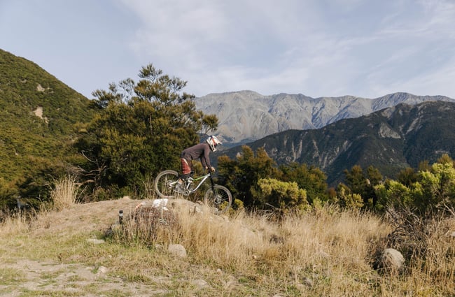 Side view of someone on their mountain bike at Middle Hill MTB.