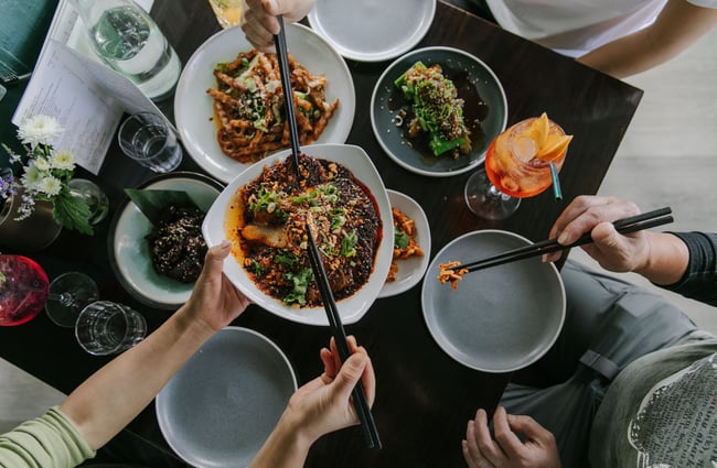 Birds eye view image pf a table filled with plates of food.