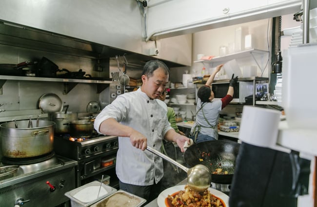 A man making noodles in a kitchen at Miss Peppercorn in Sumner.