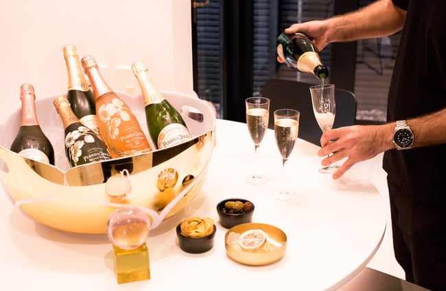 Champagne being poured into wine glasses at Mod's Hair in Merivale.