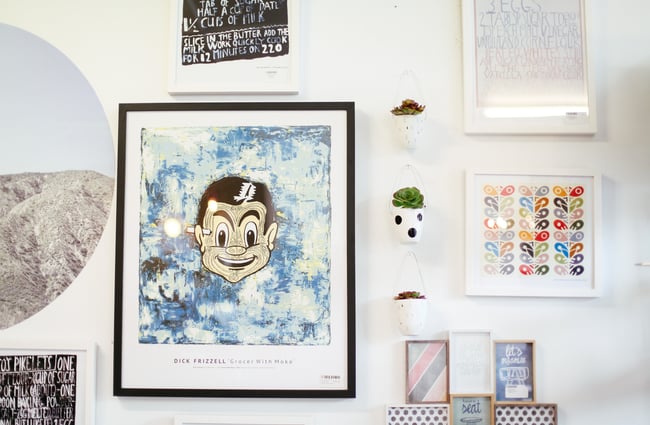 Prints on a wall.