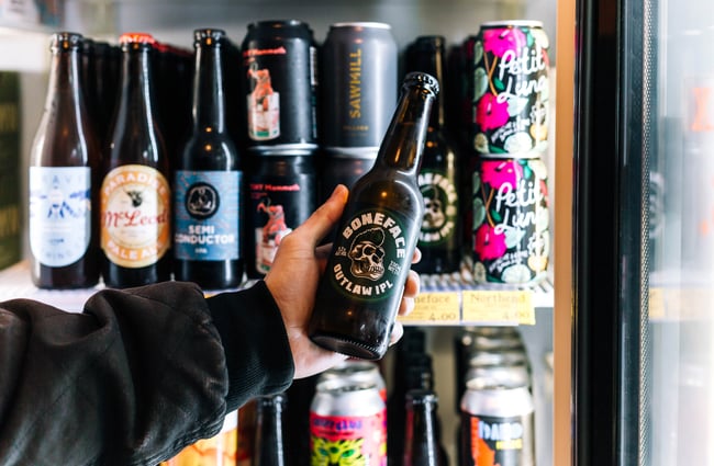 Person choosing a beer from Monkfish, Wellington.