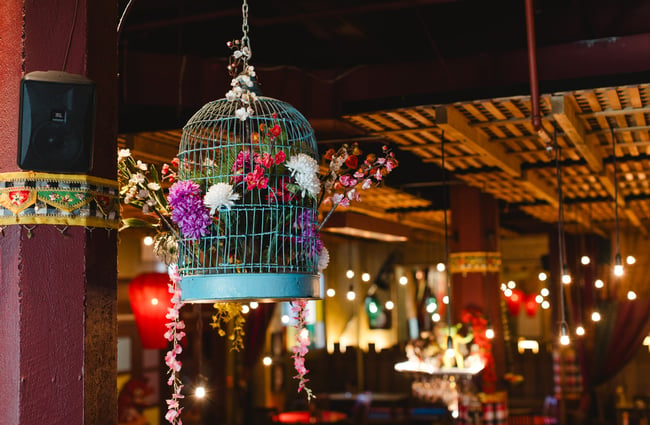 Blue birdcage decor in the dining room of Monsoon Poon.