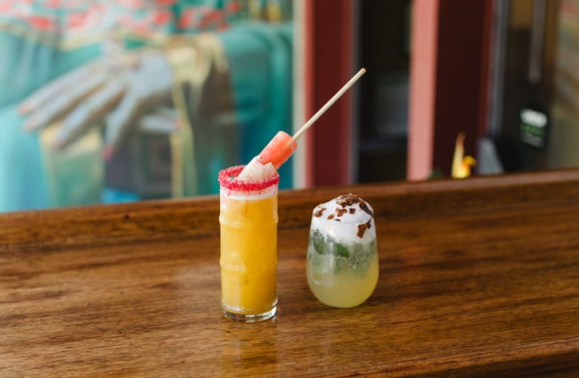Two cocktails on a table at Monsoon Poon.