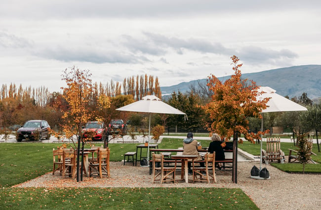 Customers sitting at a table outside at Monte Christo Winery.