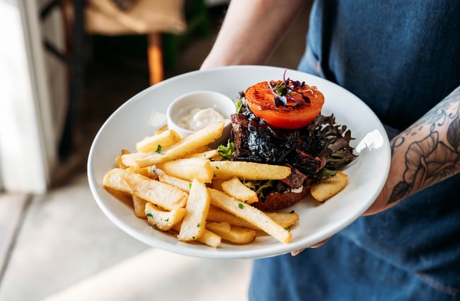 Steak and chips on a plate at MOOMAA Cafe and Design Store in Rangitikei.