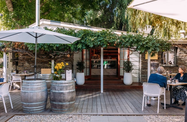 The vine covered entrance to Mora Wines Queenstown.