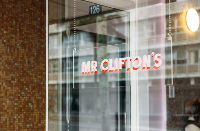 A 'Mr Clifton's' sign on a glass window.