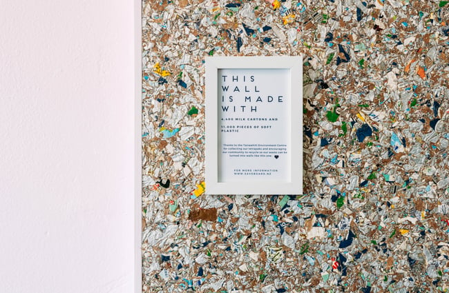 A sign on a wall talking about what the wall is made of.