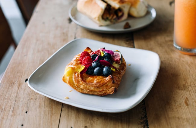 Close up of pastry with fresh berries from Mr T's Baked Goods and Eatery, Auckland.