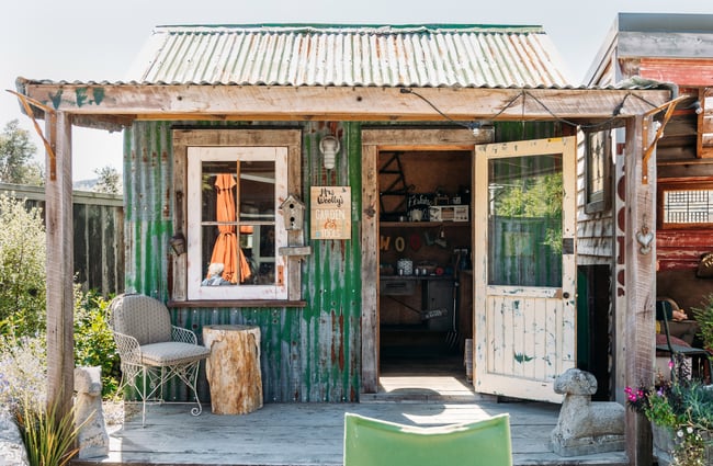 A small green hut at the Mrs Woolly's store.