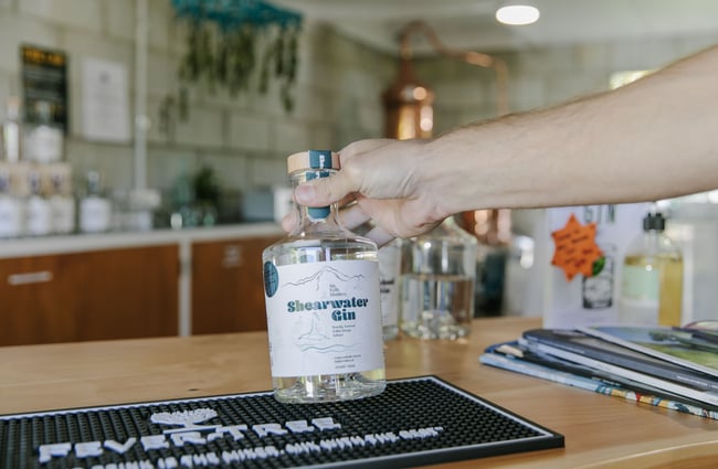 Hand holding a bottle of Shearwater Gin from Mt Fyffe Distillery, Kaikōura.