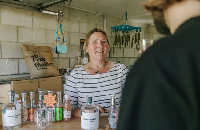 Justine doing a tasting with a customer at Mt Fyffe Distillery, Kaikōura.