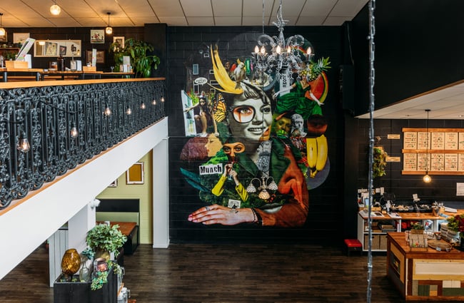A huge mural painted on a black wall.
