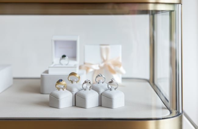 Various rings sit in their display cabinet at Naveya & Sloane Jewellery.