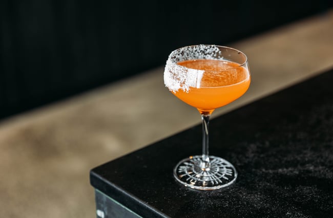 Orange cocktail on the table at Neat at Made.