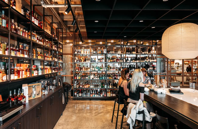 Customers sitting at the bar at Neat at Made.
