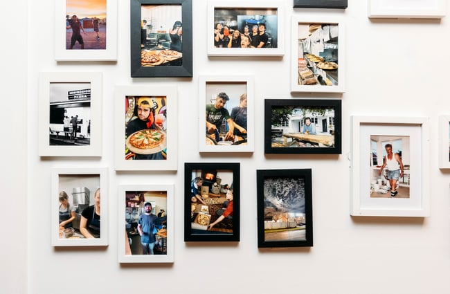 Small framed pictures on a wall.