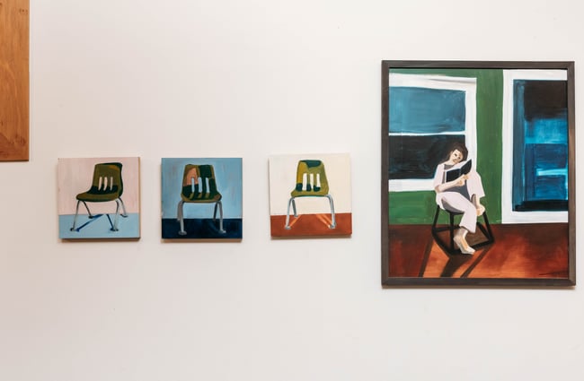 Works of art on a white wall.