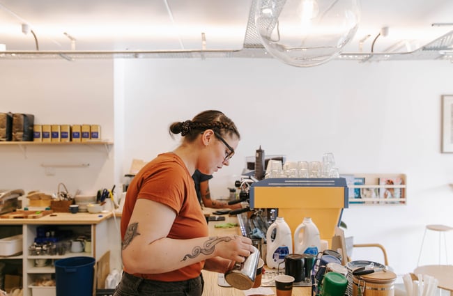 Barista making a coffee at Niche Cafe and Eatery in Sumner.