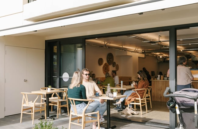 People dining in the outdoor seating area at Niche Cafe and Eatery in Sumner.