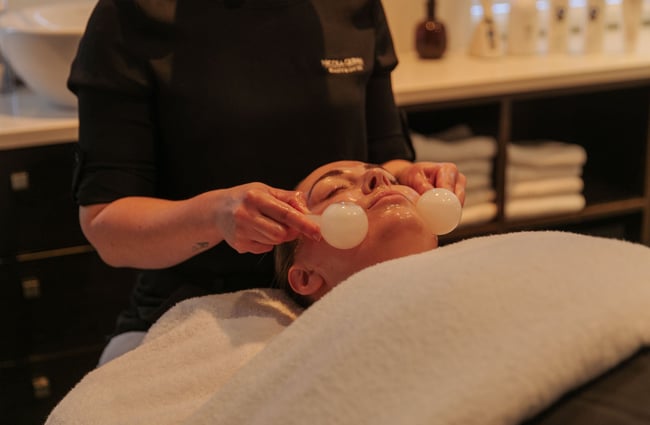 Glass bulbs being applied to a face.