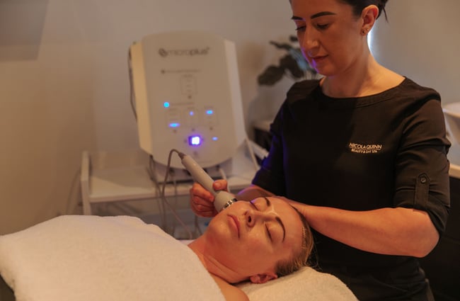 A therapist doing a laser facial on a client at Nicola Quinn Beauty and Day Spa in Merivale, Christchurch.
