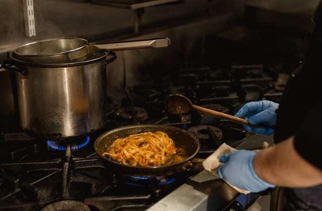 Pasta being cooked on the stovetop at Nicolini's.
